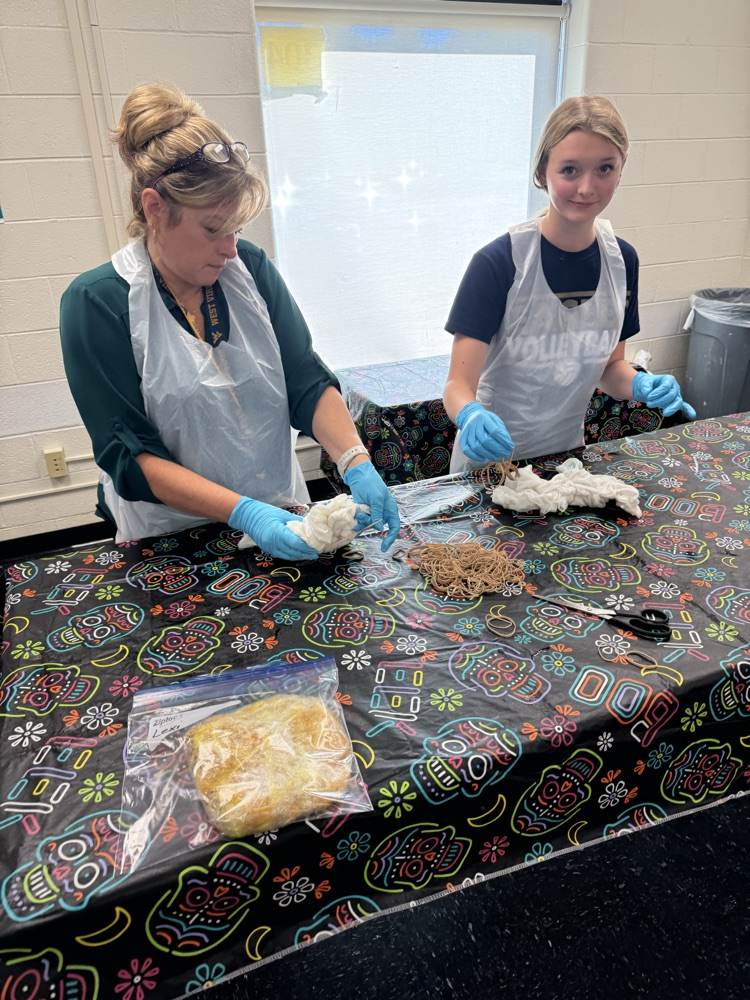 Arah Stoneking taught Mrs. Walton how to create a heart design for her shirt  