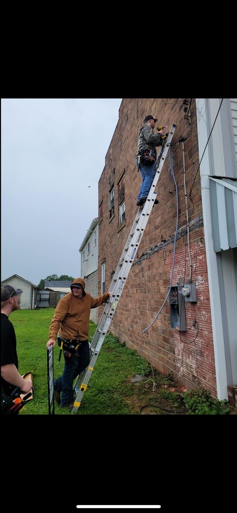 student on ladder