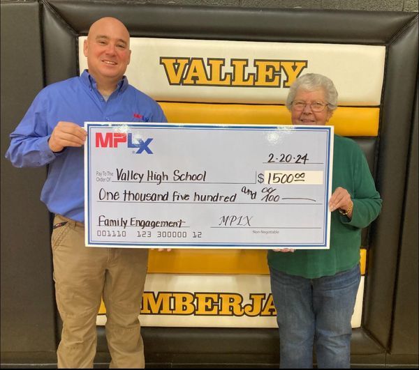 principal and MPLX rep with giant check