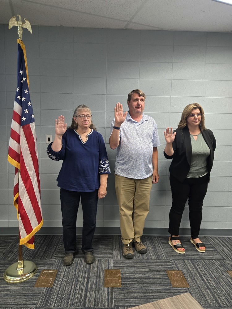 Board members taking the oath of office
