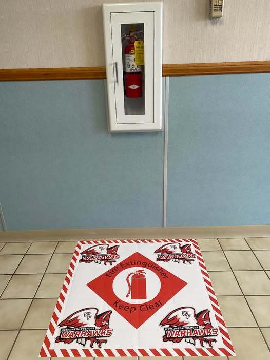 WF Manufacturing Students Install New Floor Markers Around Fire Extinguishers
