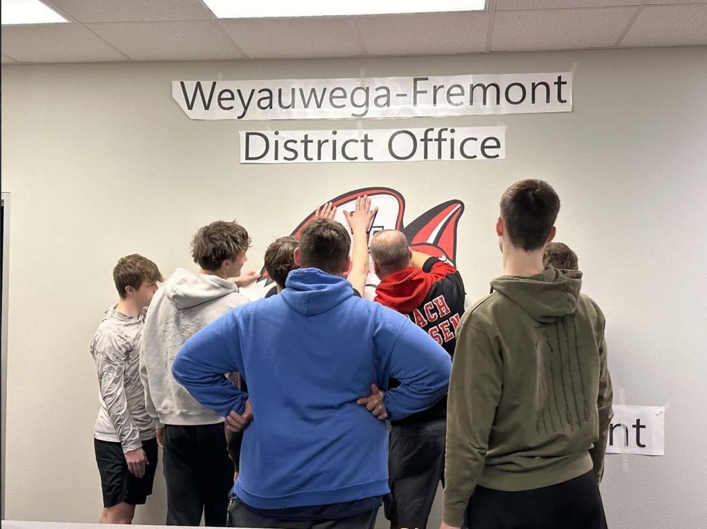 Students Preparing For Their Piece to Be Applied To The Wall