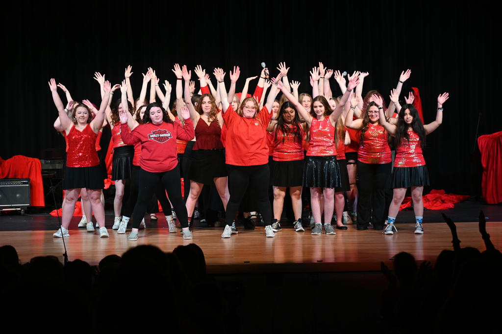WF Pops Concert raising their hands during a number