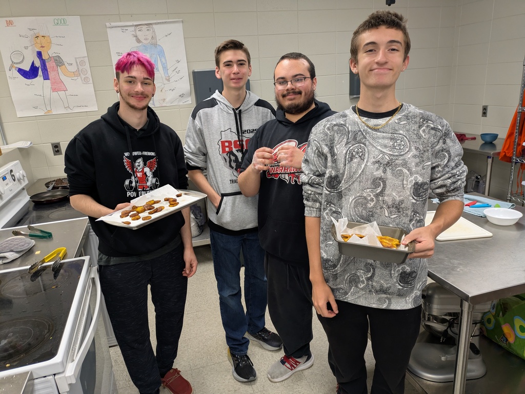 Spanish students showing off their dishes 