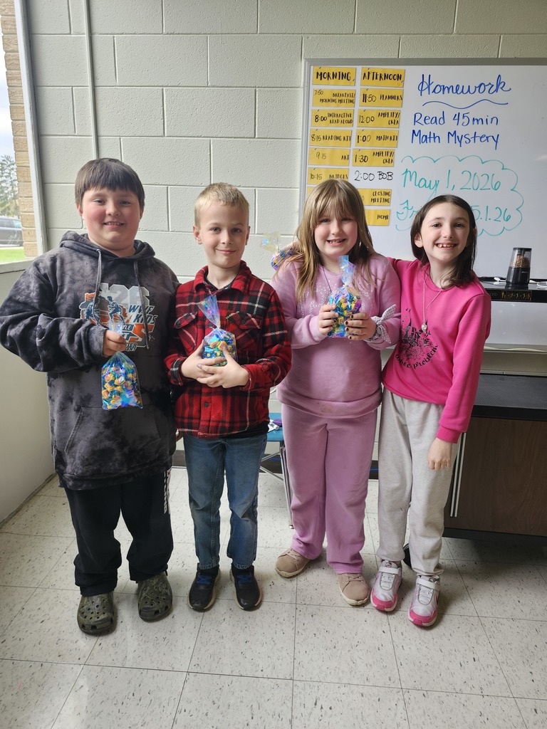 Students show off their bag of treats from Battle of the Books