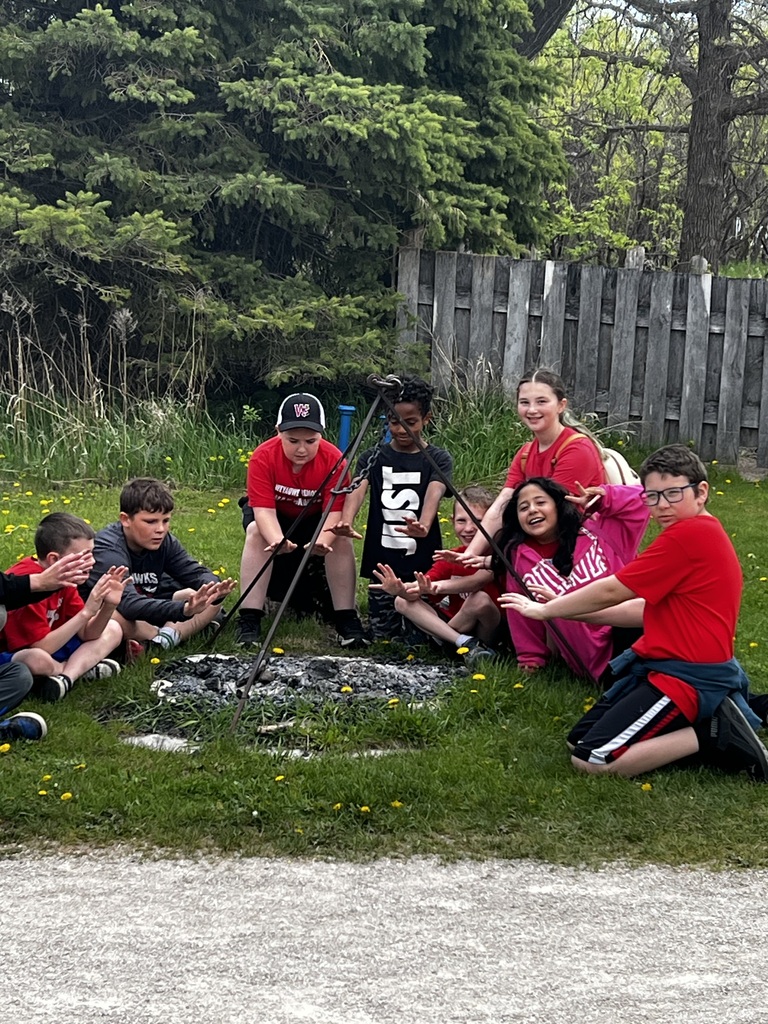 Students gathered around a fire pit at Heritage Hill