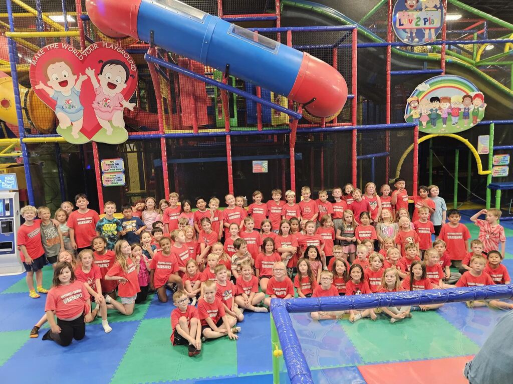 Group picture of Kindergarten-2nd grade students at Luv 2 Play
