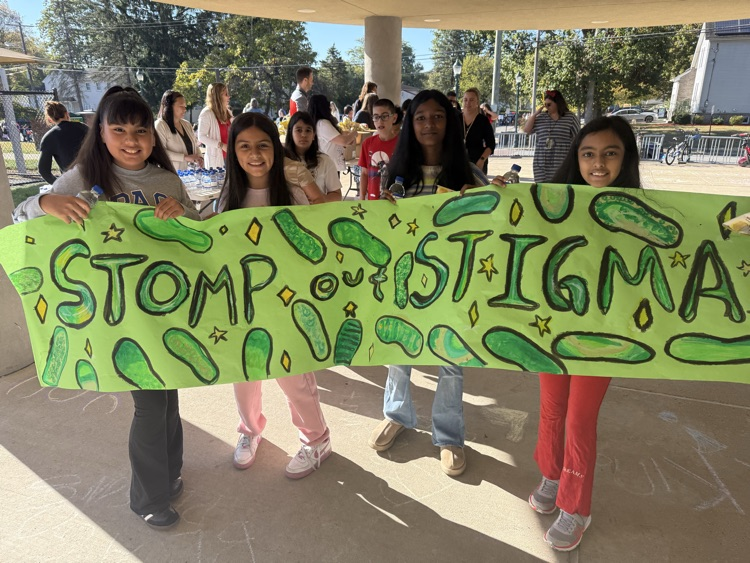 kids holding sign