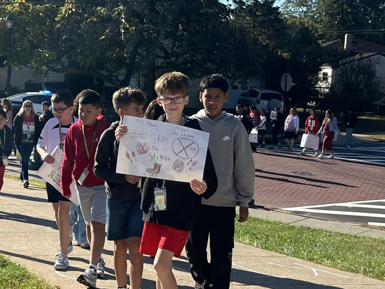 kids holding sign