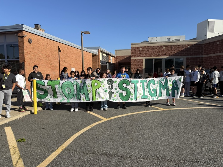 kids holding sign