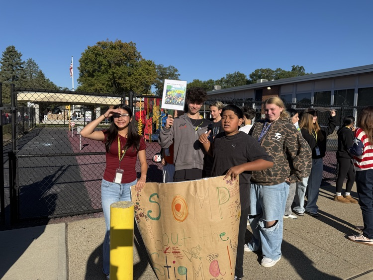 kids holding sign