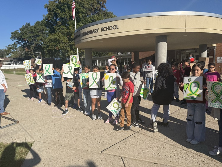kids holding sign