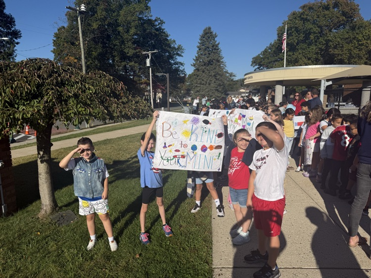 kids holding sign