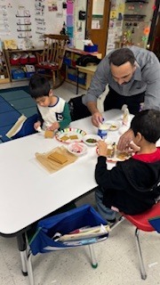 kids making gingerbread houses