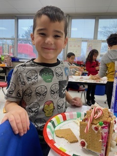 kids making gingerbread houses