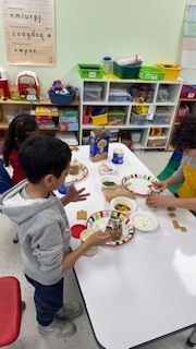 kids making gingerbread houses