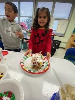 kids making gingerbread houses