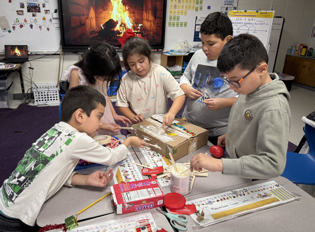 kids making gingerbread houses