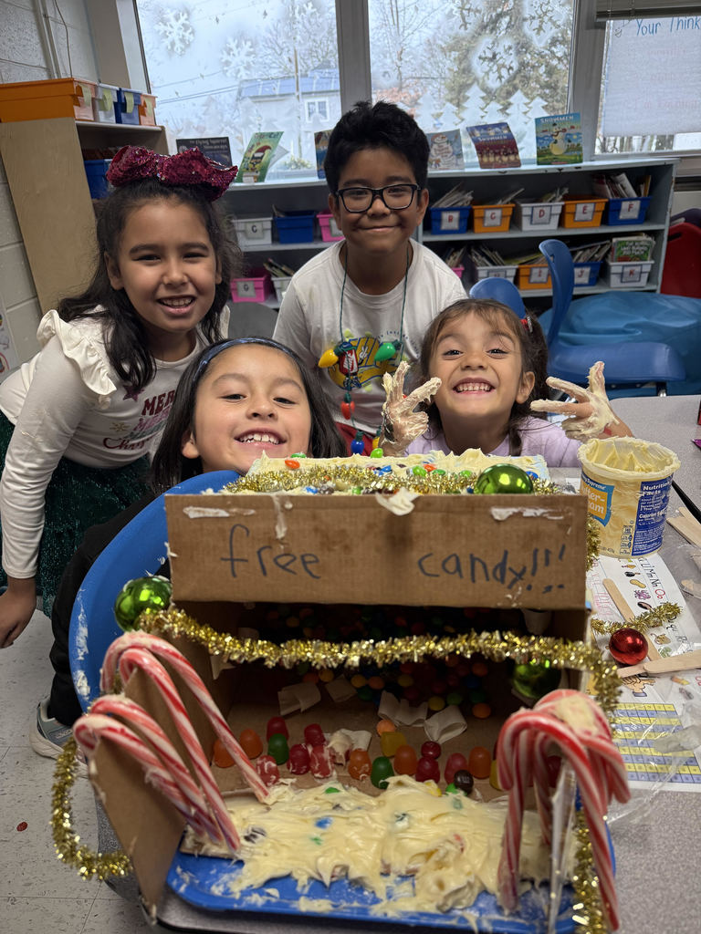 kids making gingerbread houses