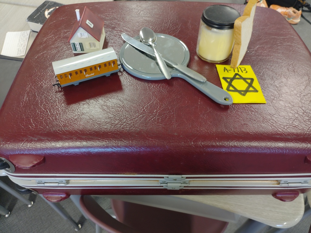 WCC Where Literacy Meets Life 📚✨ Grab Bag Book Talks: Resilience in Action ✨📚 In our latest Unit 3 literature circle project, students dove deep into the theme of Resilience through a powerful selection of books centered around the Holocaust. Working in small groups, students read and explored their chosen texts—then brought them to life in a whole new way.  💡 The Challenge? Each group was tasked with presenting a Grab Bag Book Talk, choosing symbolic objects to represent major ideas, themes, characters, or turning points in their book. This encouraged deep text-to-text and text-to-world connections while pushing students to think metaphorically and present creatively.  👜 Some of the most powerful examples included:  A barbed wire strand to represent the brutal setting of a concentration camp  A broken mirror as a metaphor for shattered identity  A cracked compass symbolizing a character's lost sense of direction and faith  Our students blew us away with their insightful interpretations and creative presentations. Their ability to extract meaning, make connections, and present with passion reminds us once again how brightly our Bears shine—especially when given the chance to engage with literature in meaningful, hands-on ways.  We are so proud of their hearts, minds, and voices. 📖💬💛 #WCCBears #BookTalkMagic #ResilientReaders