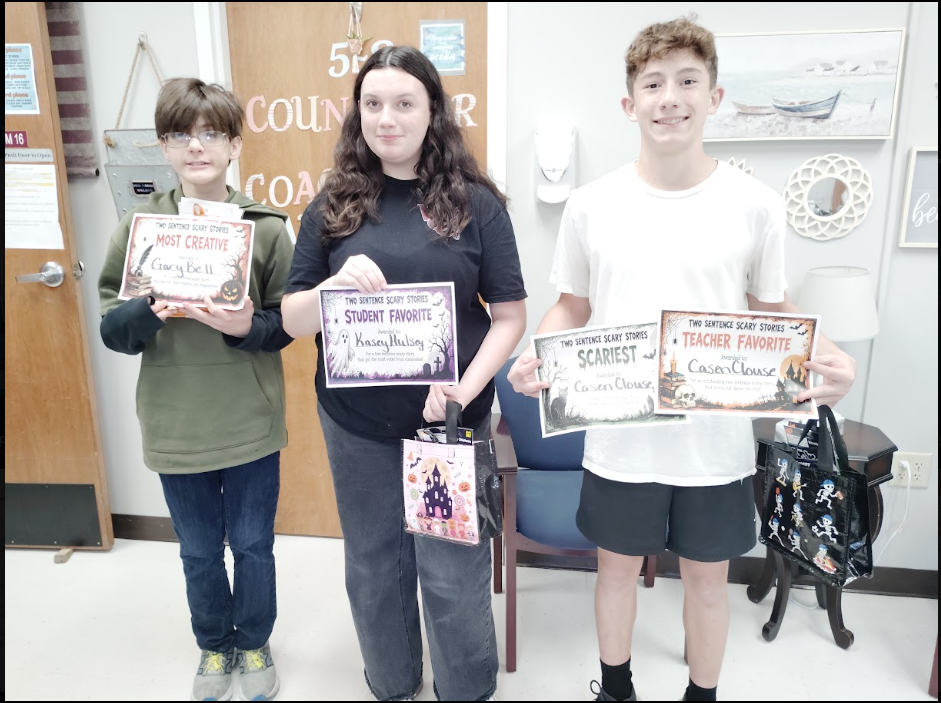 👻🎃 Two Sentences. Endless Suspense! 🕸️ Our 7th and 8th graders have been putting their creativity to the test! As part of our study of sentence types, sentence structure, and suspense, students took on the challenge of writing their very own Two-Sentence Scary Stories! ✍️💀 With just TWO sentences, they had to create suspense, build tension, and send chills down their readers' spines! 🏆 Congratulations to our contest winners! We are so proud of the creativity and talent our WCC Bears displayed! 🐻🧡 Who knew two sentences could be so SPOOKTACULAR?!