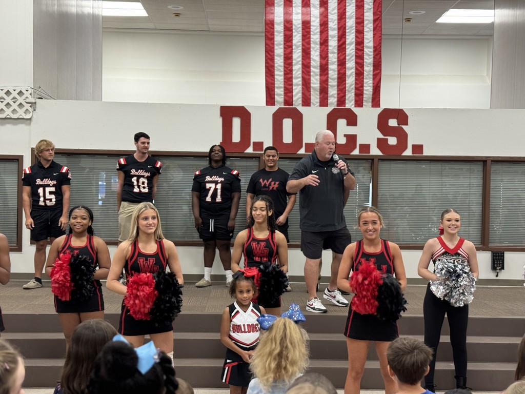 WHHS cheer, dance, football players, and percussionists visited Hardin Elementary.