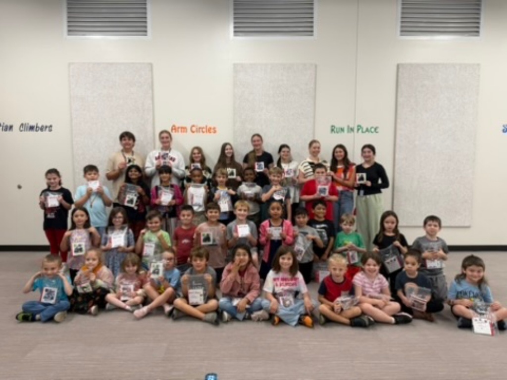 The WHHS Chick-Fil-A Leader Academy members donated books to our elementary school students and read to them.