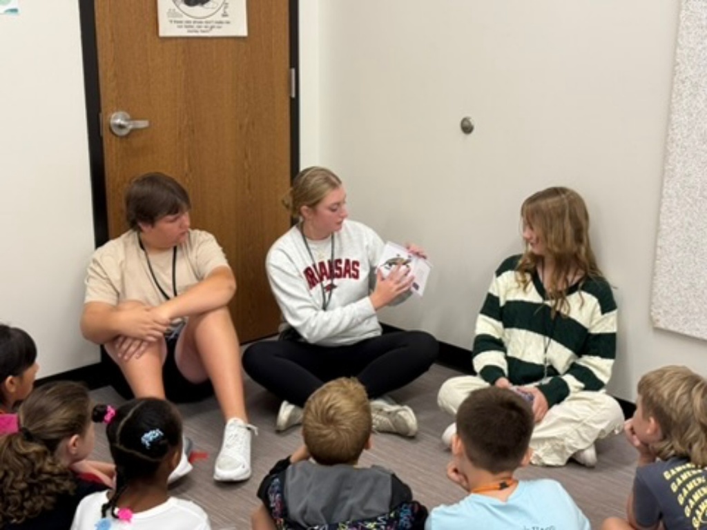 The WHHS Chick-Fil-A Leader Academy members donated books to our elementary school students and read to them.