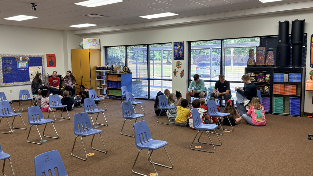 pictures from The WHHS Chick-fil-A Leader Academy service project, donating books to students and reading books