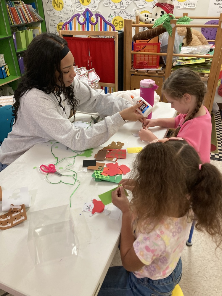 Ms. Taylor from the high school visited and helped us make Christmas ornaments. 