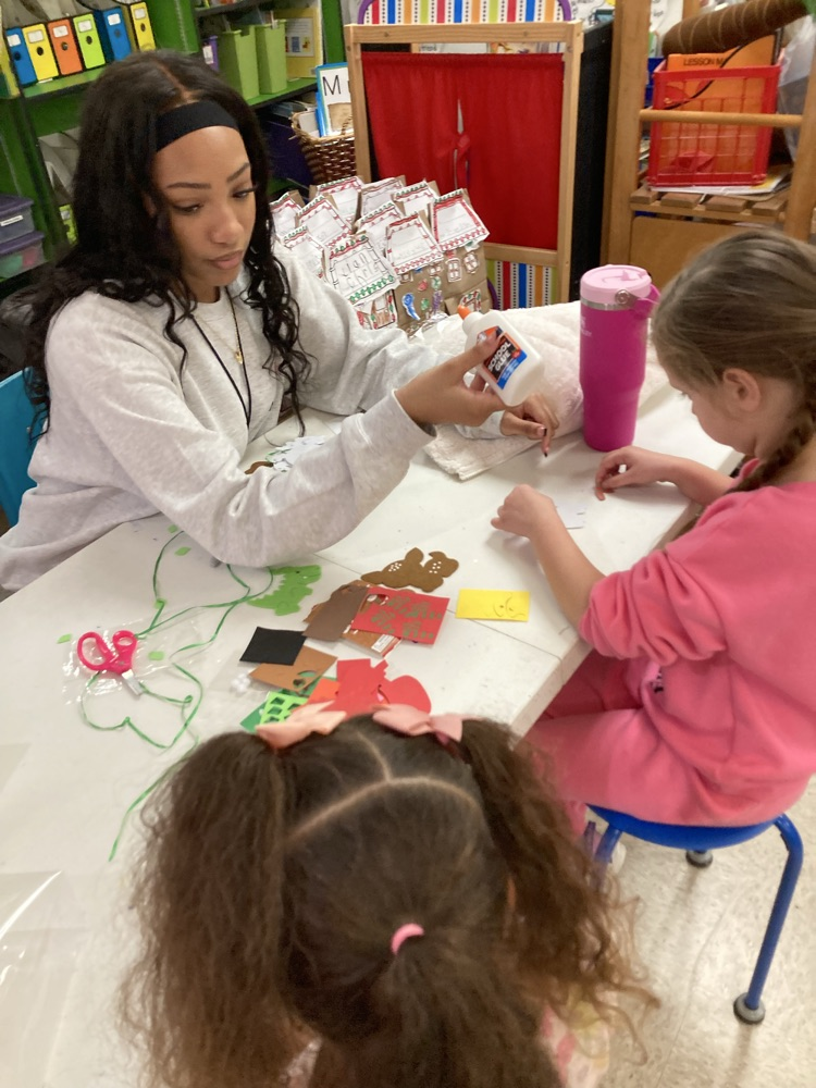 Ms. Taylor from the high school visited and helped us make Christmas ornaments. 