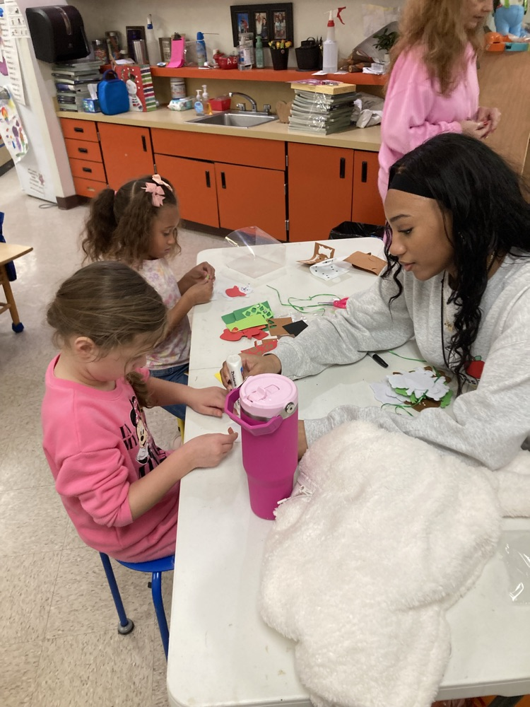 Ms. Taylor from the high school visited and helped us make Christmas ornaments. 