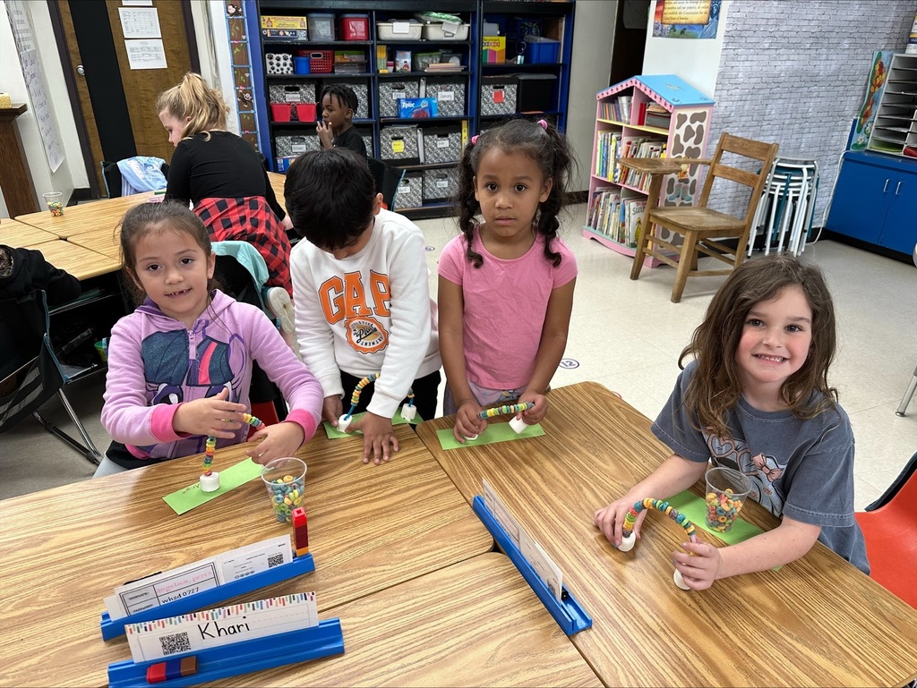 Students making rainbow craft