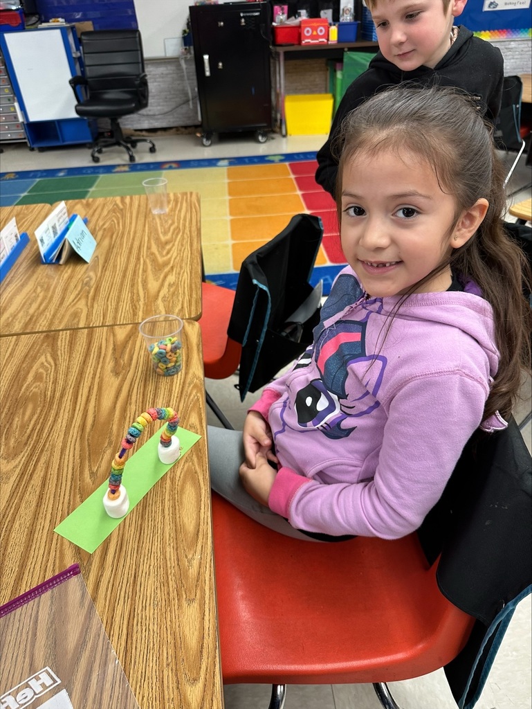 Student making rainbow craft