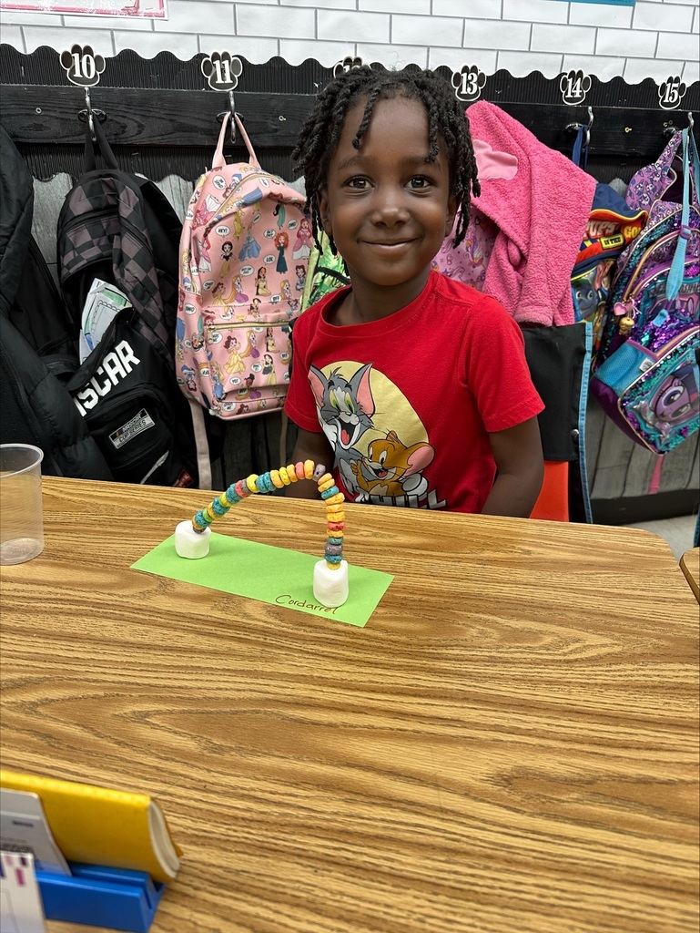 Student making rainbow craft