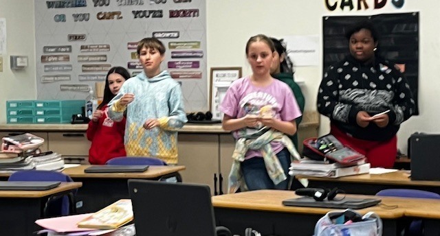 Students identifying figurative language