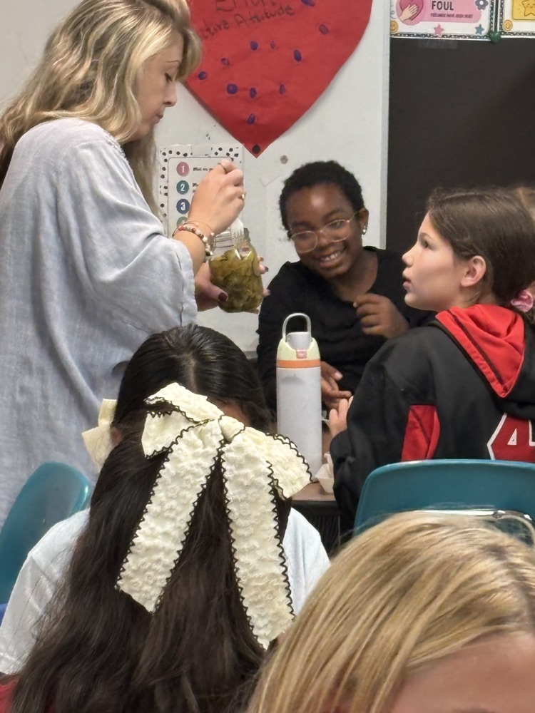  Mrs. Addison talked about canning food. And brought some bread and butter pickles and salsa that she canned for the Great Girls to try. 