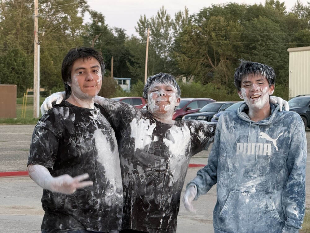 High School students covered in white paint