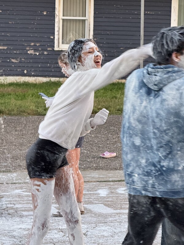 High School students covered in white paint