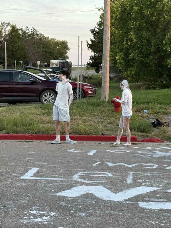 High School students covered in white paint
