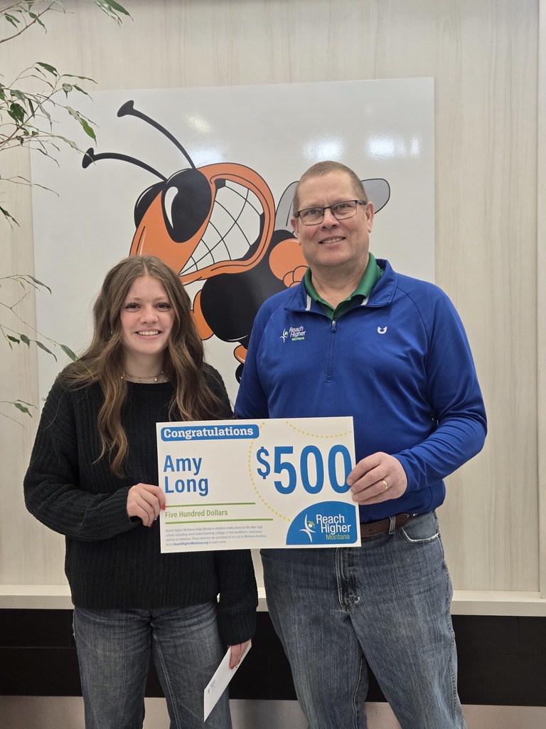 Student is presented with a scholarship from Reach Higher Montana.