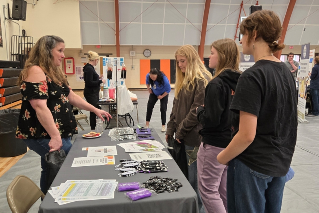 Students visit with one of our career fair guests.
