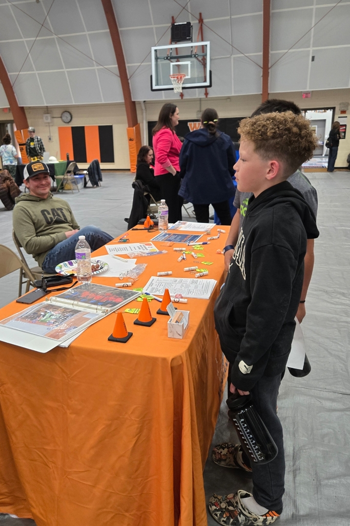 Students visit with one of our career fair guests.