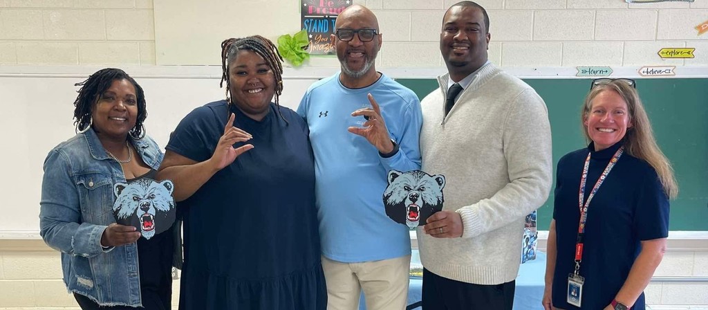 SCC's Career Coach Mrs. Frankye Boone, NWA Graduation Coach Ms. Kwabena Meares, NWA Principal Mr. Jamal Soles, and NWA History Teacher Mrs. Jennifer Dorman pose for a photo with Livingstone College Recruiter Coach Sylvester Kyles. 