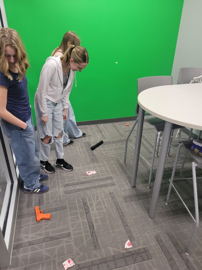 Criminal Justice students studying mock crime scene