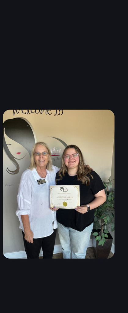 Allison Parker holding Cosmetology license certificate