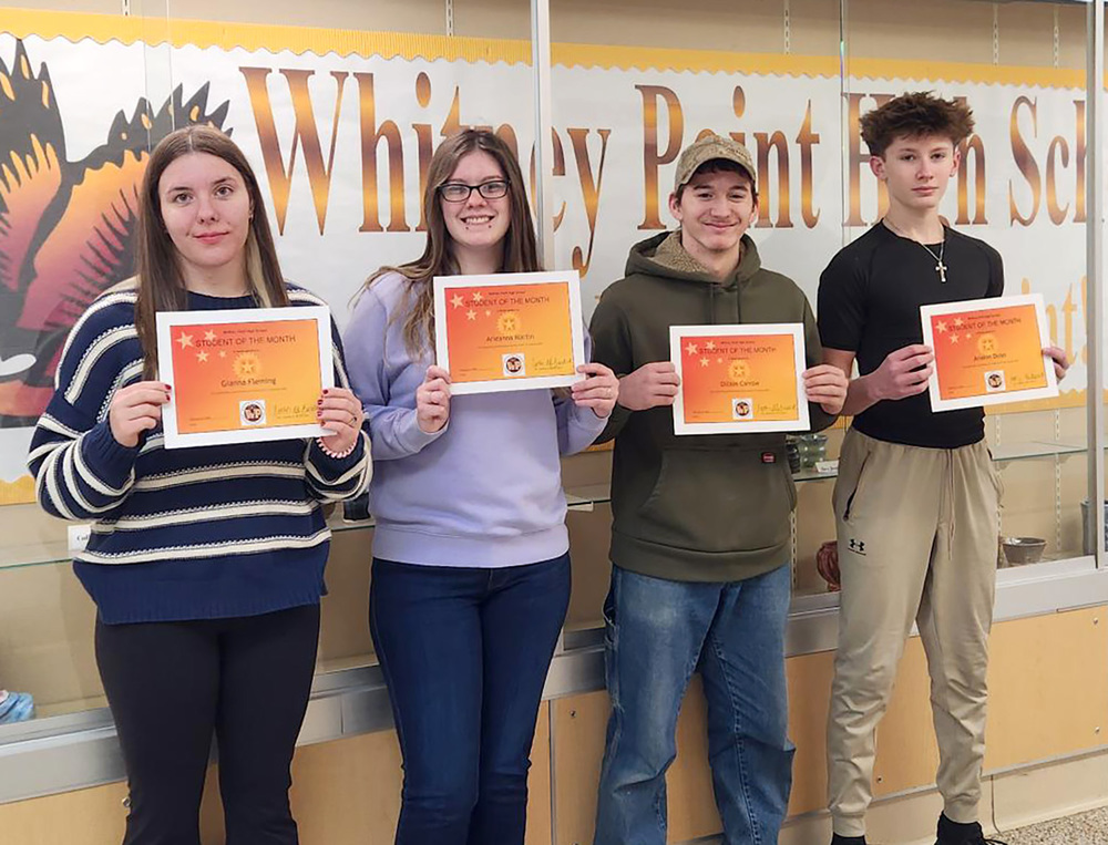 Four Whitney Point High School students hold their certificates for being selected Students of the Month for January 2026.