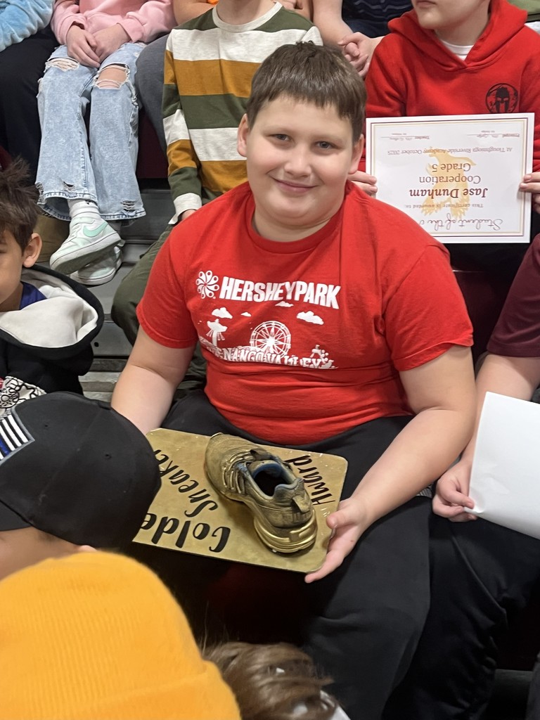 Student with golden shoe
