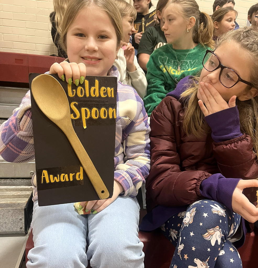 A Tioughnioga Riverside Academy student holds up her class' Golden Spoon Award.