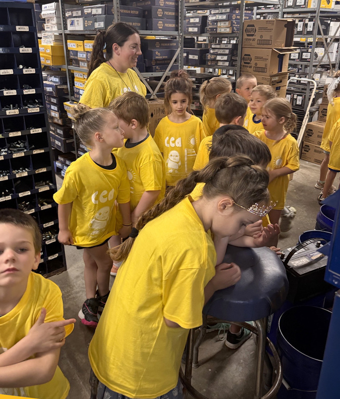 CEA Kindergarten students explore the stock area of a local Whitney Point business.